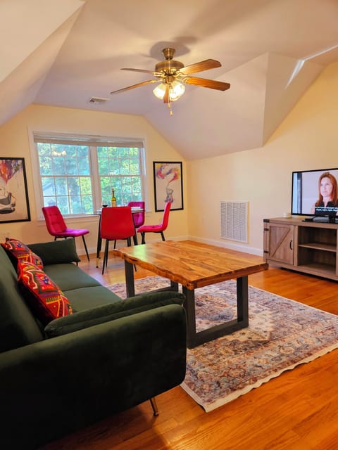 Living room with lots of bright light and a smart TV