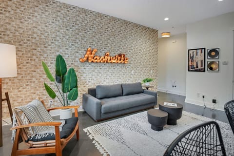 Living room with full futon, and Smart TV