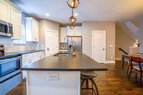 Modern kitchen with toaster, Keurig coffee maker, blender, and more