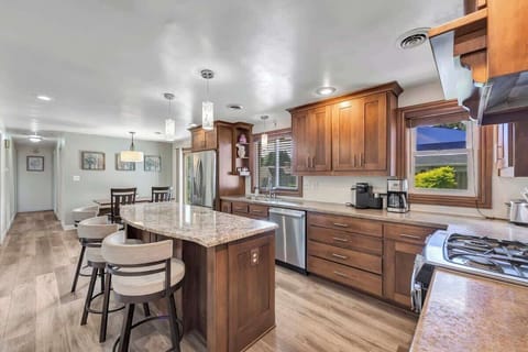 Fully equipped kitchen with pots/pans, utensils, cooking appliances