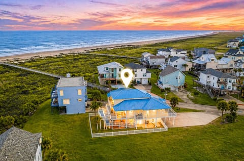 Take Me Awave beach house in Galveston, Texas. Stunning coastal home with ocean views, sunset skies, and steps to sandy shores—perfect for a relaxing seaside getaway for families and friends.