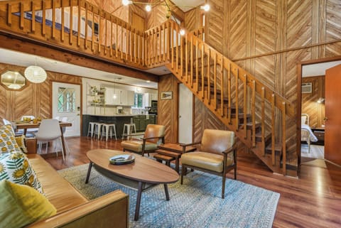 Just off the living space near the stairs is Bedroom 1 and Bathroom 1.