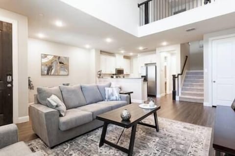 Large open downstairs living room plus a half bathroom off the kitchen.