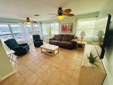 The spacious living room is filled with natural light.