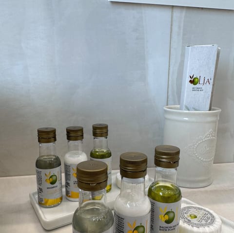 Luxury Suite, Balcony, City View | Bathroom | Hair dryer, bathrobes, slippers, towels