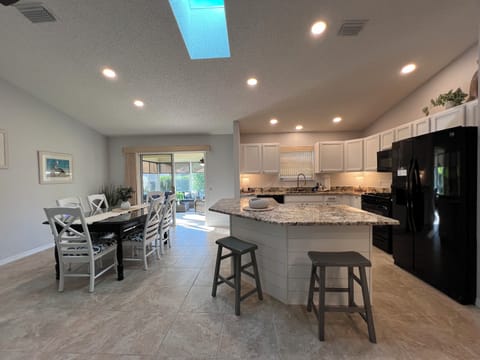 Large counter space with stools and Dining Room