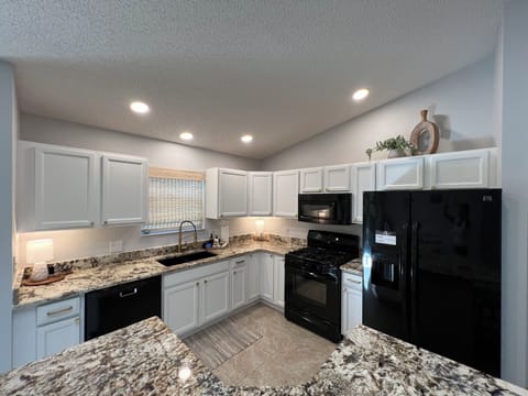 The Updated and clean kitchen is ready for any meal. 