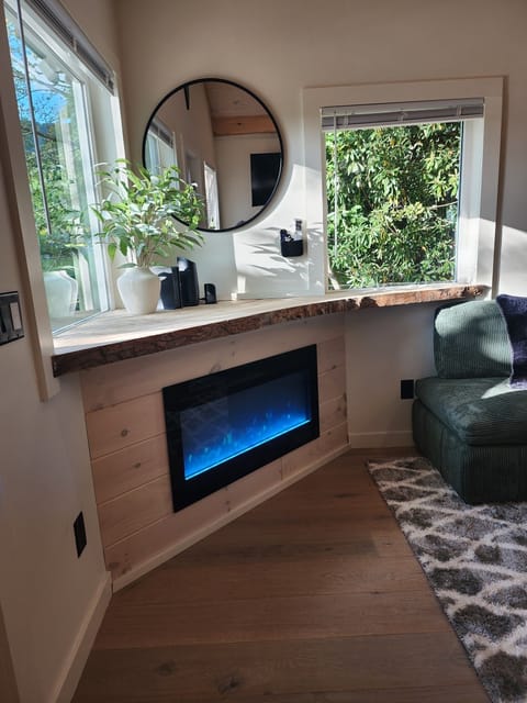 Cozy Living Room with 55-inch Smart TV, Fireplace, and bistro table.