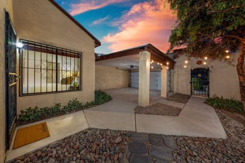 View of the entrance from the street, garage, and the home`s front entrance