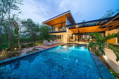 View at sunset of the pool and home