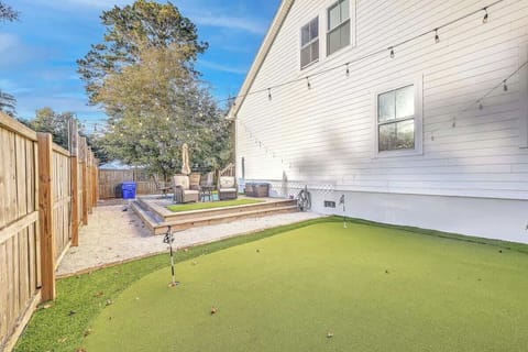 Home Highlight: Enjoy the backyard deck with a mini golf area for relaxing and playful afternoons.