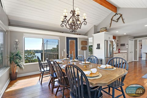 One of 2 dining tables that seats 8. Located off kitchen.