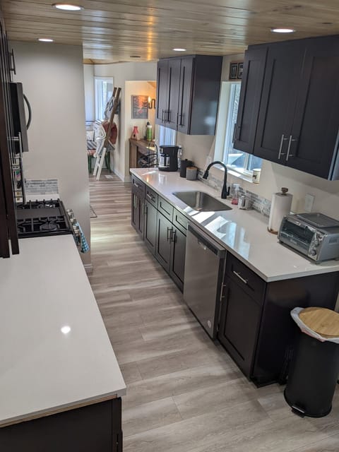 Our remodeled kitchen is stocked with pretty much everything you should need for a stay away in the mountains. We have a gas stove and oven, microwave, refrigerator, toaster oven, drip & keurig coffee makers, slow cooker, pots, pans, plates, utensils, etc