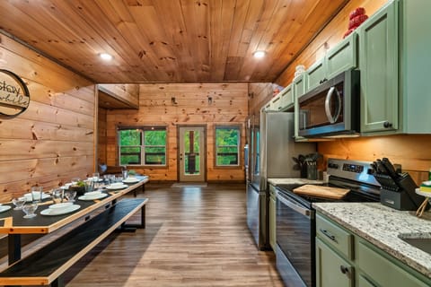 Gather for memorable meals in a fully stocked kitchen with a custom dining table
