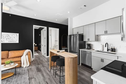 Lots of natural light pouring into this fully equipped kitchen. Seating for two at the island. We provide all the utensils you might need to enjoy a meal at home.