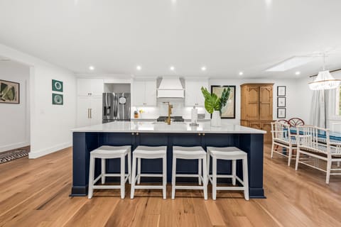 The kitchen/dining area is anchored by a large island - seating for 4