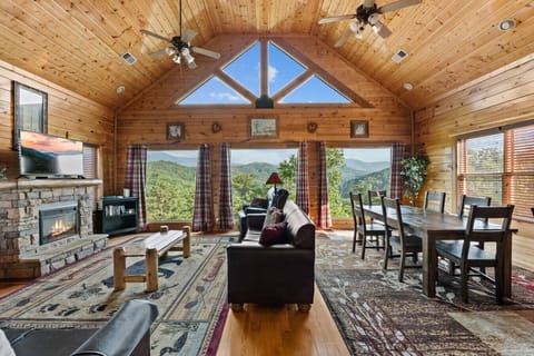 Soaring ceilings, warm wood tones, and panoramic windows make this space unforgettable. Curl up by the fire or sip wine while the sun sets over layers of rolling green hills.