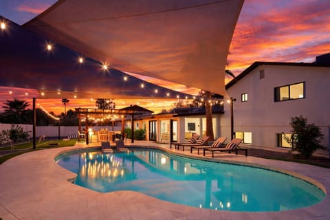 Relax in this Scottsdale oasis with a pool, hot tub, grill under bistro lights, putting green, chess, horseshoes, corn hole, fire pit, and outdoor dining for the perfect getaway.