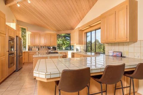 Kitchen has bar stool seating
