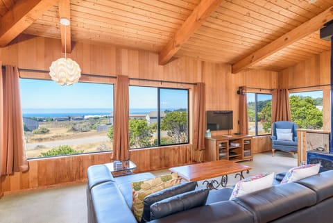 Cozy and spacious living area with TV