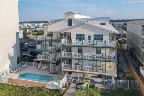 Outdoor Oasis: Dive into relaxation with a sparkling pool and beach views just steps away!