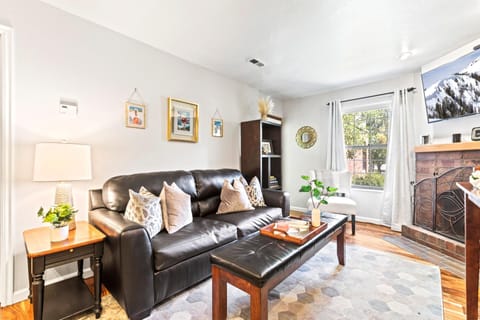Cozy up in the open living area with a sofa sleeper, fireplace, and direct access to your private deck.