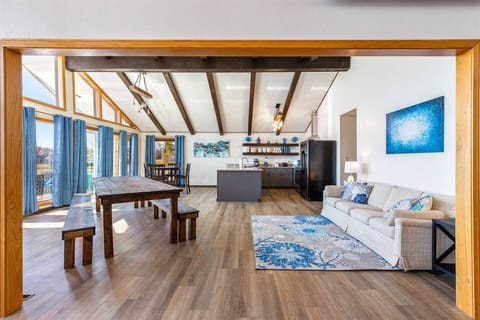 With a large farm table, bar seating, and high boy table, there is plenty of dining seating for the whole family. Sofa converts to 2 twin beds.