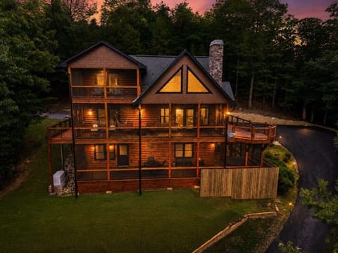 Charming cabin retreat with multiple decks and serene forest views.
