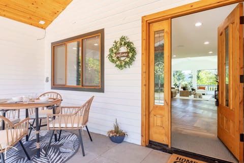 An inviting entrance awaits you, with a blend of rustic and modern elements for a warm welcome.