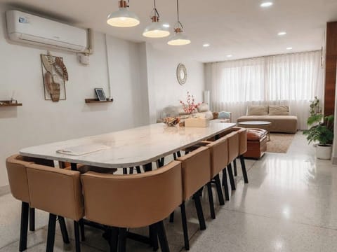interior, indoor, climate control, couch, living area, dining table