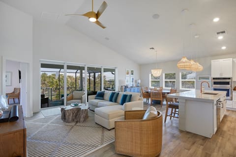 Gorgeous open floorplan new construction home with heated and caged pool