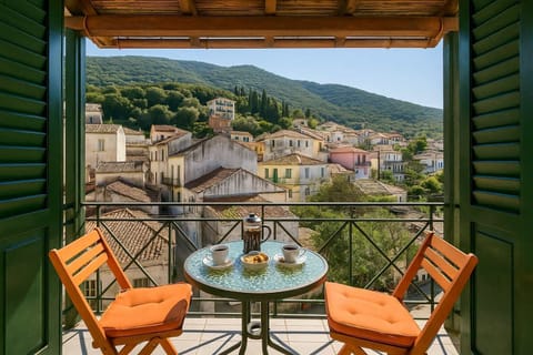Balcony View Over the Village with Mountain Scenery – A peaceful spot to enjoy morning coffee while taking in the authentic village atmosphere.