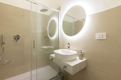 Deluxe Double Room, Balcony, City View | Bathroom | Shower, hair dryer, towels, soap