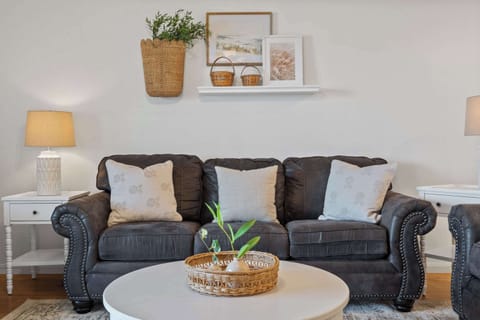 Open living space with Queen sofa sleeper, Smart TV, and balcony access