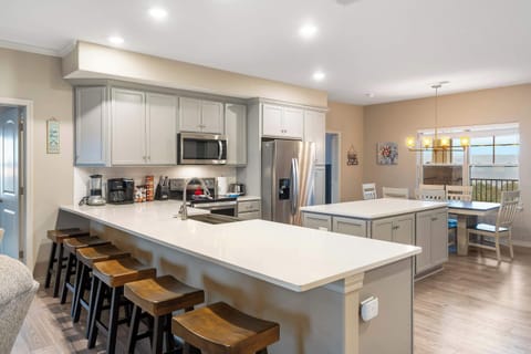 Sip morning coffee or grab a bite at the kitchen counter, with seating for 6