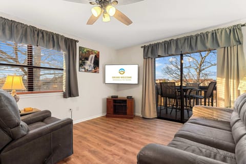 Cozy and spacious living area with TV
