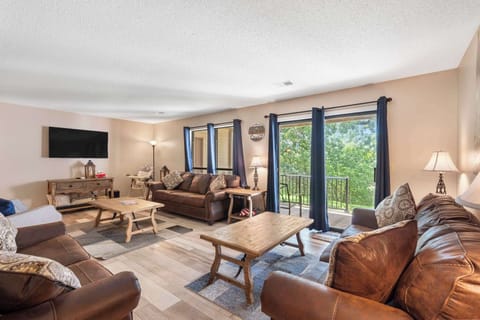 Cozy and spacious living area with TV