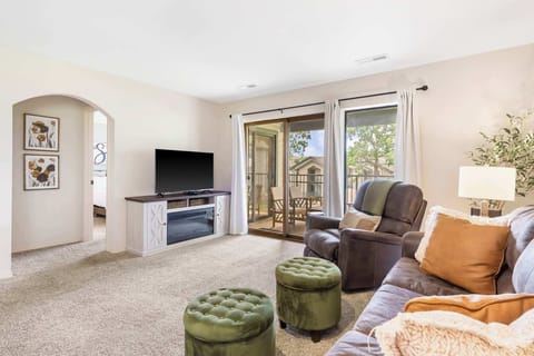 Floor-to-ceiling sliding glass doors in the living area
