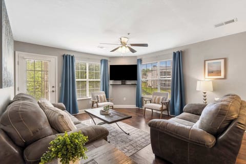 Modern spacious living area with TV