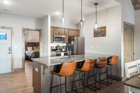 Sip morning coffee or grab a bite at the kitchen counter, with seating for 4