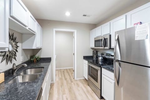 The airy kitchen offers ample space and all the comforts of home