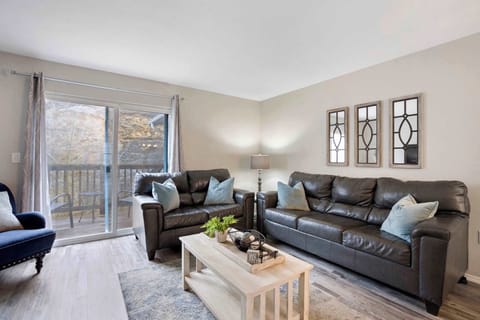 Open living space with TV and balcony access