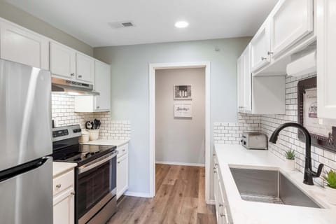 The airy kitchen offers ample space & all the comforts of home