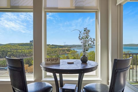 Sunroom with climate control, ample seating, lake view, and Smart TV