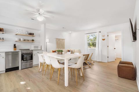 Gather for meals in the open dining area, offering seating for 8