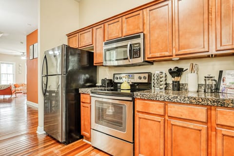 Fully equipped with ample dinnerware, cooking tools, and kitchen utensils.