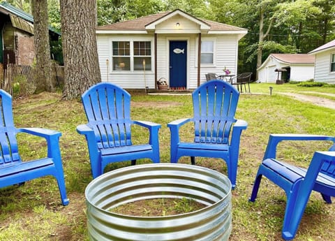 OVERALL:  The front of the cabin and the fun and family-friendly bonfire ring in the front yard.