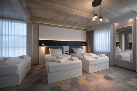 Superior Triple Room | In-room safe, desk, laptop workspace, blackout drapes