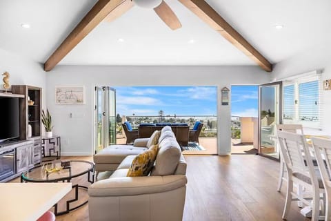 Bright, open living space with seamless indoor-outdoor flow and stunning ocean views in unit 3