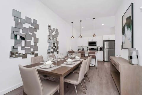 Gather around the spacious dining table, perfect for enjoying meals or game nights with family and friends.